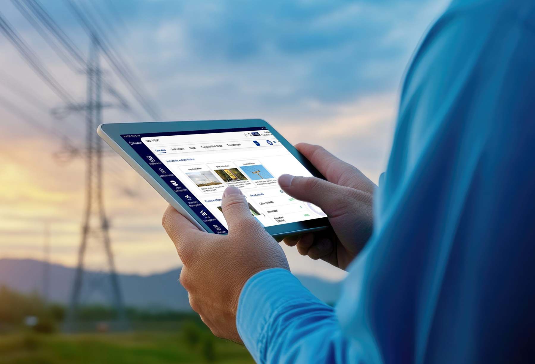 Field technician using AIQ on a tablet beside a transmission tower